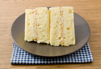 Triangle Vanilla Chiffon Cake on A White Dish