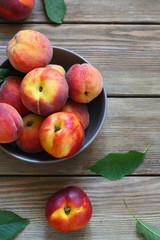 fresh and ripe peaches in bowl