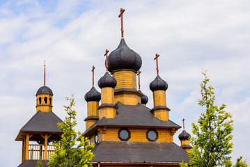 A wooden Orthodox Church in the Museum "Dudutki", Dudutki village, Belarus. Dudutki - Museum of old folk crafts and technologies.