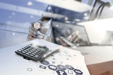Doctor working with digital tablet and laptop computer in medica