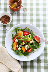 salad with tomatoes and arugula