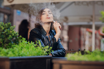 beautiful glamorous brunette smoke electronic cigarette