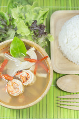 Tom yum goong homemade thai style food with wooden kitchenware