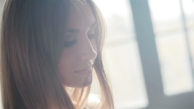 Side view of pretty women in sunlight. Close-up