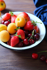 summer fruits in rustic bowl