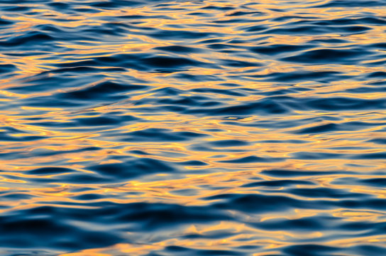 The water waves effect at sunset time