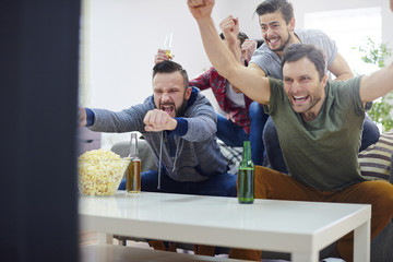 Men are proud of their team that won the game