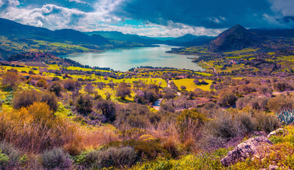 Dramatic rain clouds over lake Rosamarina