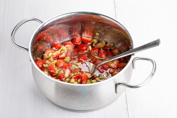 Cooking homemade strawberries jam