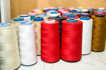 Many reels of  threads standing on the table