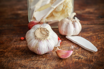 Garlic and onion organic herbs and spices on wooden background