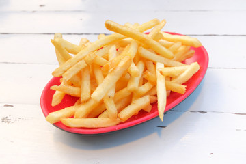 French fries in a red plate.