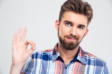 Happy man showing ok sign with fingers