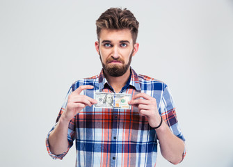 Man holding bill of USA dollar