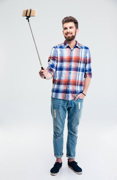 Smiling Man Making Selfie Photo With Stick