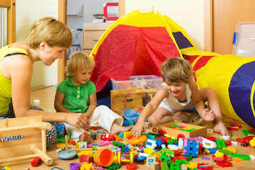 Mother and children playing