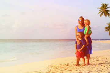 happy mother with two kids enjoy beach vacation