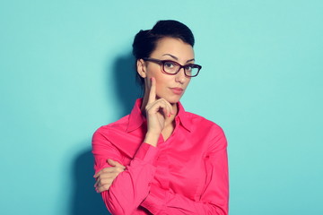 attractive cheerful young woman in glasses