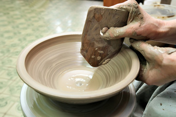 Modeling clay. Handmade pot. Painted glassware unique pattern