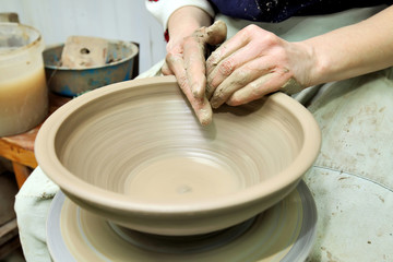 Modeling clay. Handmade pot. Painted glassware unique pattern