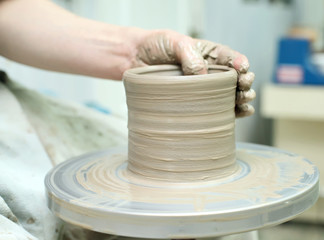 Modeling clay. Handmade pot. Painted glassware unique pattern