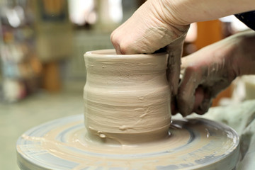 Modeling clay. Handmade pot. Painted glassware unique pattern