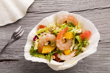 Shrimp salad with grapefruit, orange and roasted peanuts. - Serv