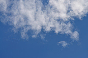 Picturesque clouds dissipating at summer sky.