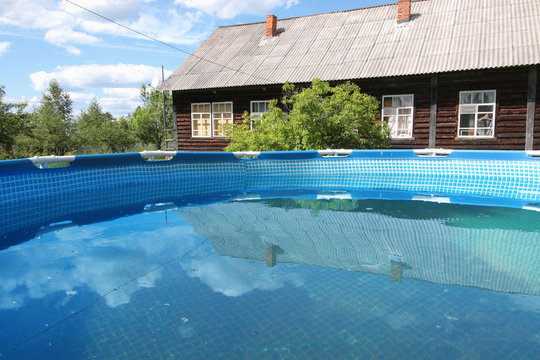 Pool in front of a country house