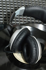 Fototapeta na wymiar player with headphones on vinyl plates