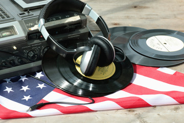 player with headphones on vinyl plates