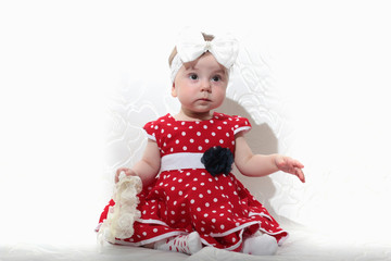 little girl in a red dress and beads