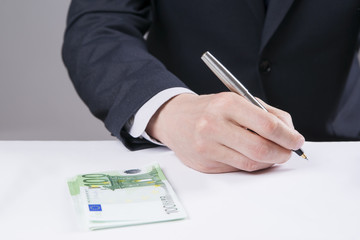 Concept - corruption. Giving a bribe. Money in hand