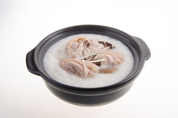 Traditional chinese porridge rice gruel served in claypot