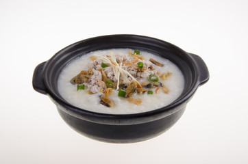 Traditional chinese pork porridge rice gruel served in claypot