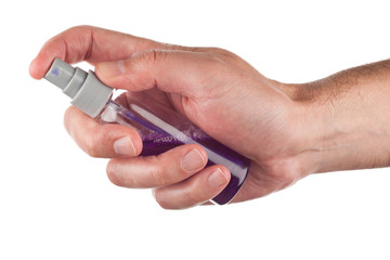 Hand holding a spray bottle