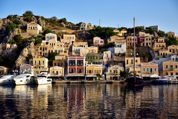 Fototapeta na wymiar Boats moored in Symi Island harbour Greece