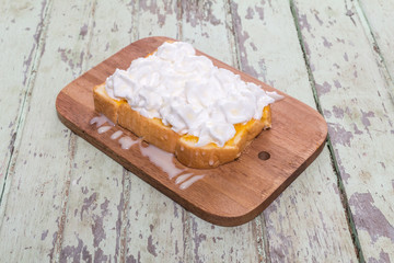 Toast cream is placed on a wooden table