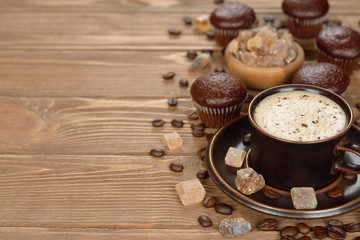 Cup of coffee and chocolate muffins
