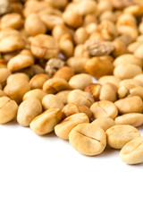 unroasted coffee beans on white background