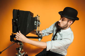 young man with retro camera 