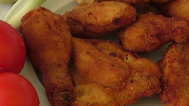 A plate of fresh, hot, crispy fried chicken 
