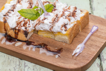 Toast cream is placed on a wooden table