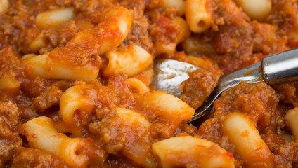 Beef and Macaroni TV dinner with a spoon