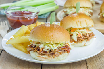 Beef brisket sliders on a white plate