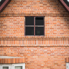old building with brick wall and window
