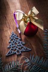christmas toys simbol of fir tree and branches on wooden board
