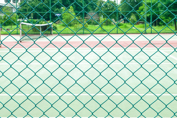 Fototapeta premium Green fence mesh for partition tennis court