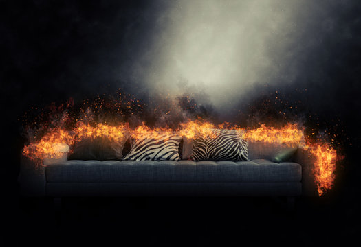 Sofa engulfed in burning flames