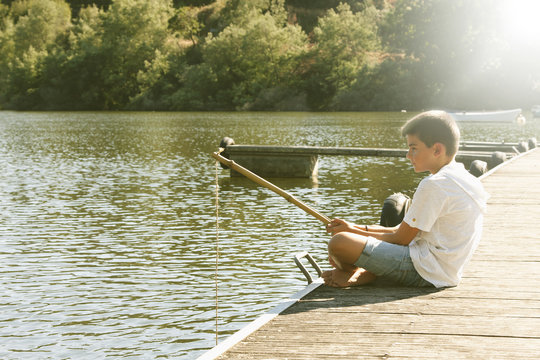 boy fishing in the river